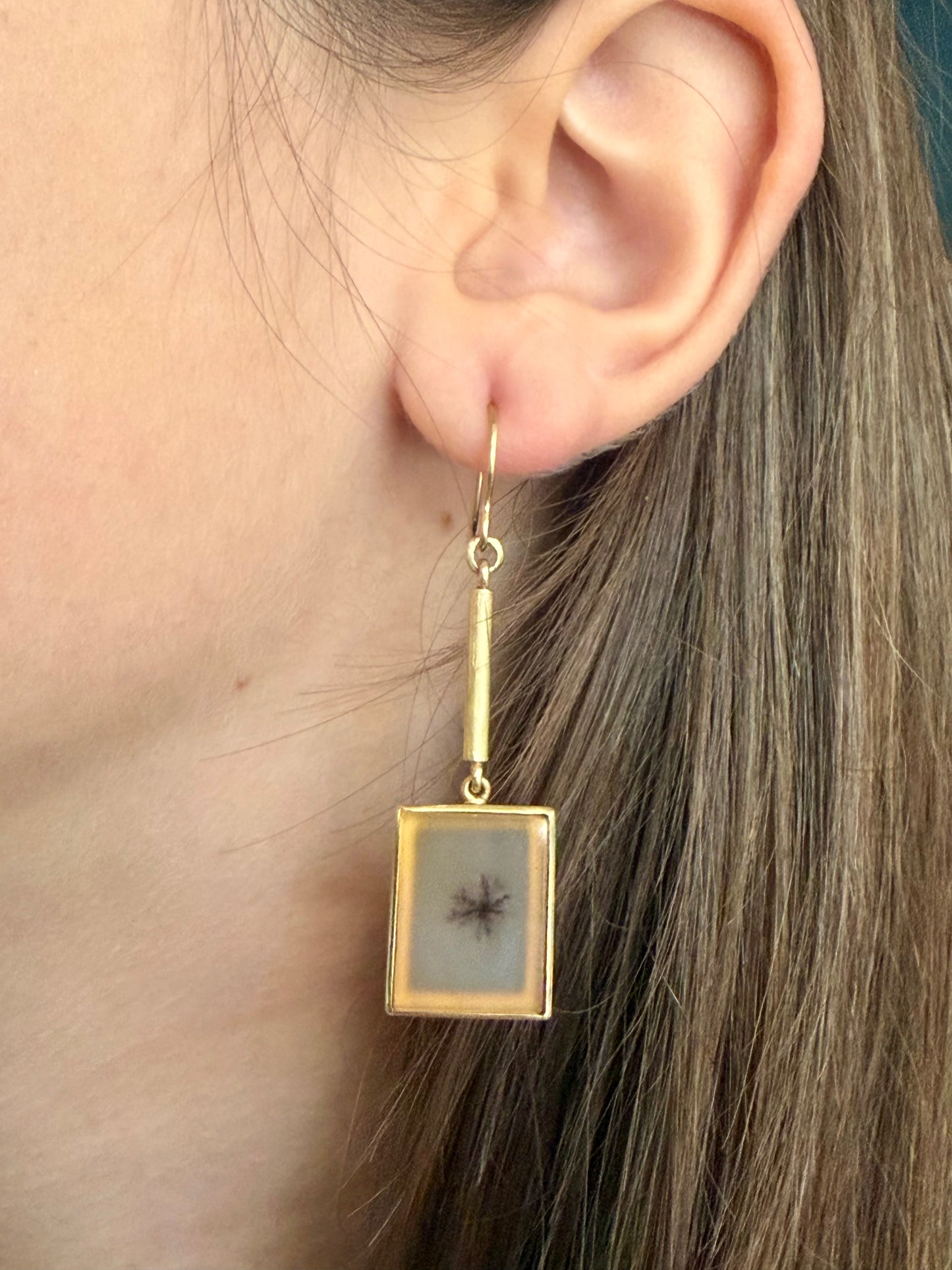 Model wearing Dendritic agate and 18k gold earrings